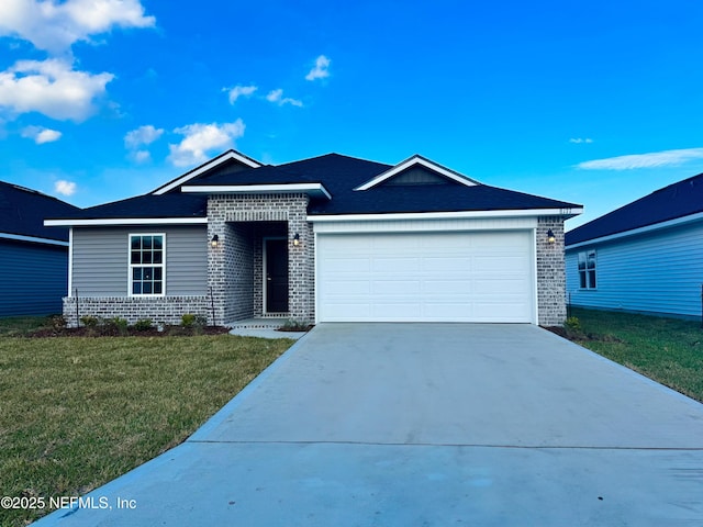 view of front of home with a garage and a front yard