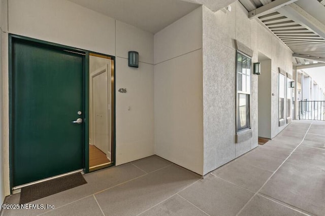 doorway to property with a patio