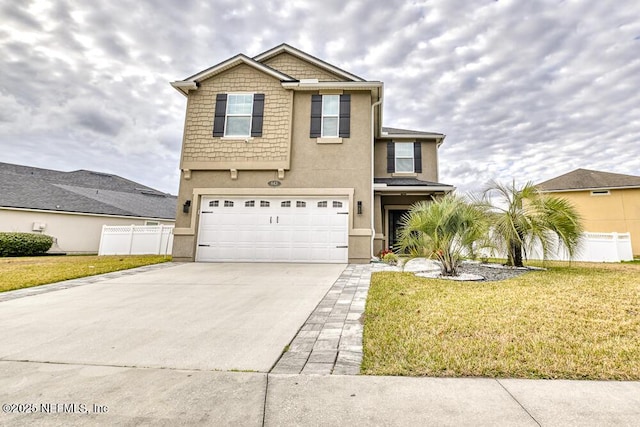 view of front property with a garage and a front lawn