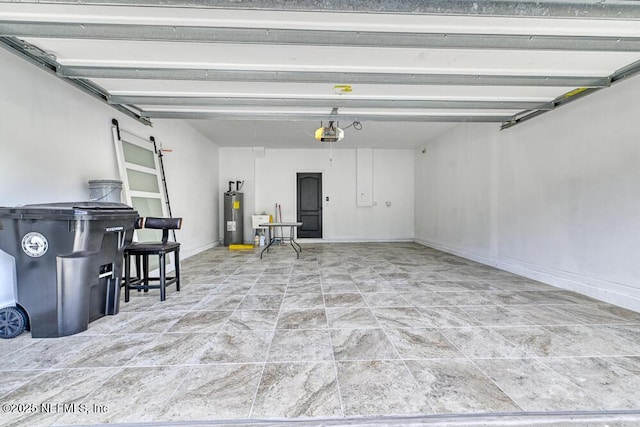 garage featuring electric water heater and a garage door opener