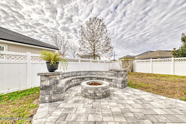 view of patio featuring an outdoor fire pit