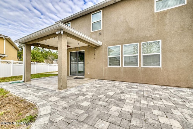 back of house with a patio