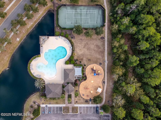 birds eye view of property with a water view