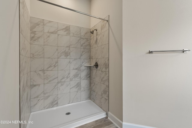 bathroom with a tile shower