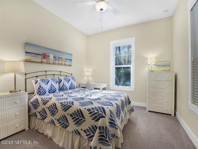 bedroom with ceiling fan and light carpet