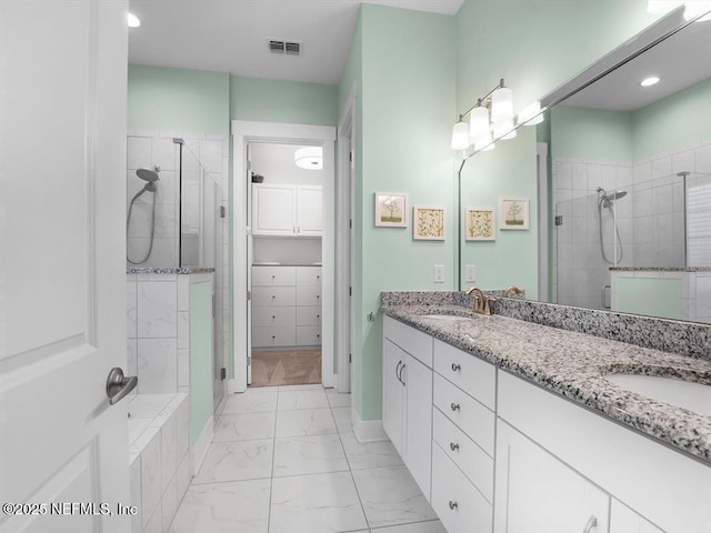 bathroom with vanity and an enclosed shower