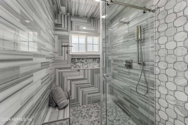 bathroom featuring an enclosed shower