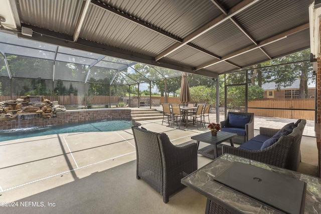 view of patio featuring pool water feature, glass enclosure, and a fenced in pool