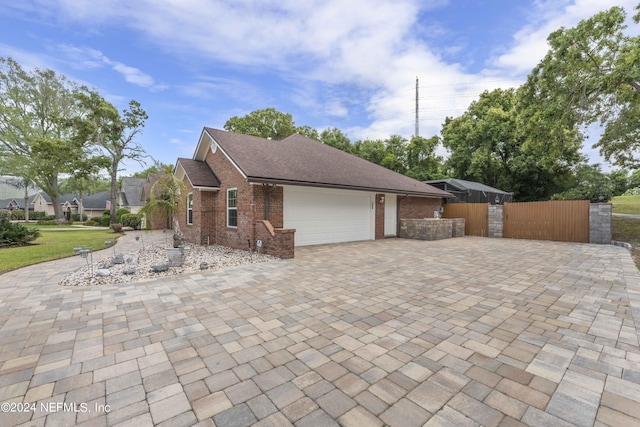 view of side of home featuring a garage