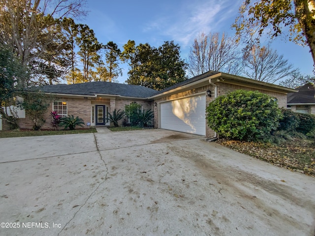 single story home featuring a garage