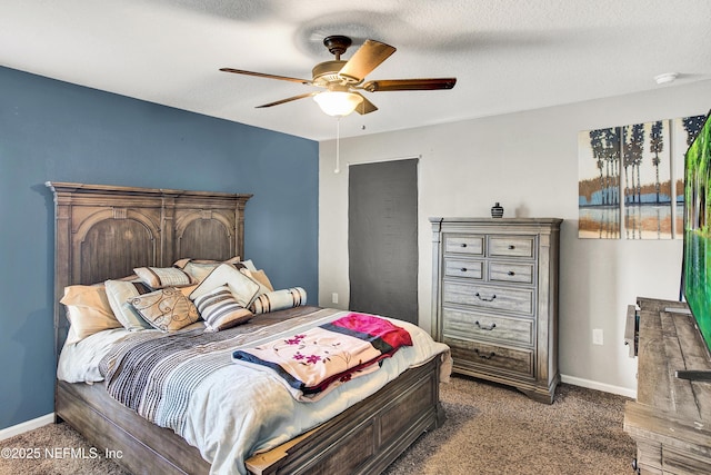 carpeted bedroom featuring a textured ceiling and ceiling fan