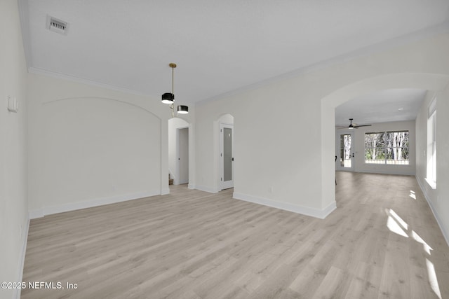 unfurnished living room with ceiling fan, light hardwood / wood-style floors, and ornamental molding