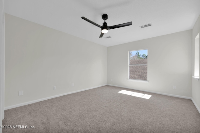 carpeted empty room with ceiling fan