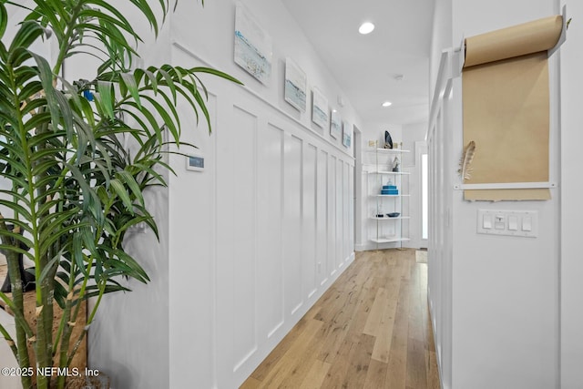 hallway with light hardwood / wood-style flooring