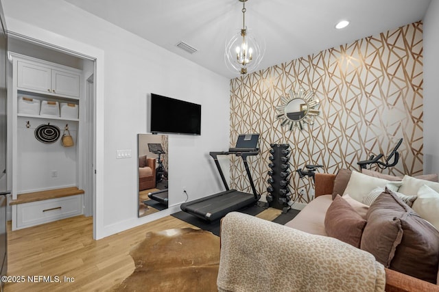 interior space with a chandelier and light wood-type flooring