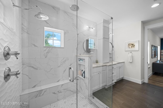 bathroom with vanity and an enclosed shower