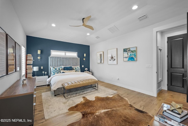 bedroom with light wood-type flooring and ceiling fan