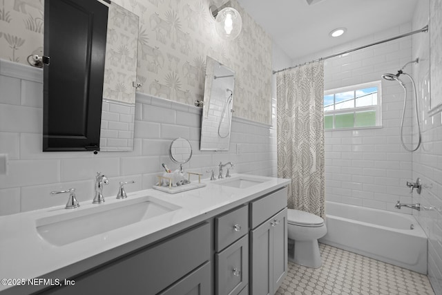 full bathroom featuring vanity, tile patterned flooring, toilet, tile walls, and shower / tub combo with curtain