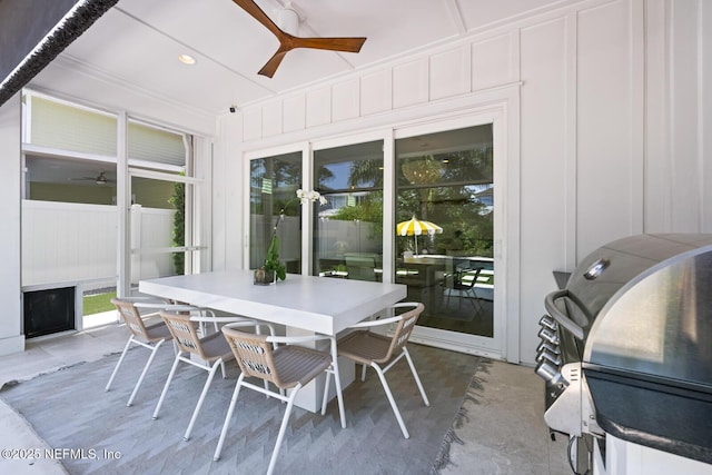 sunroom featuring ceiling fan