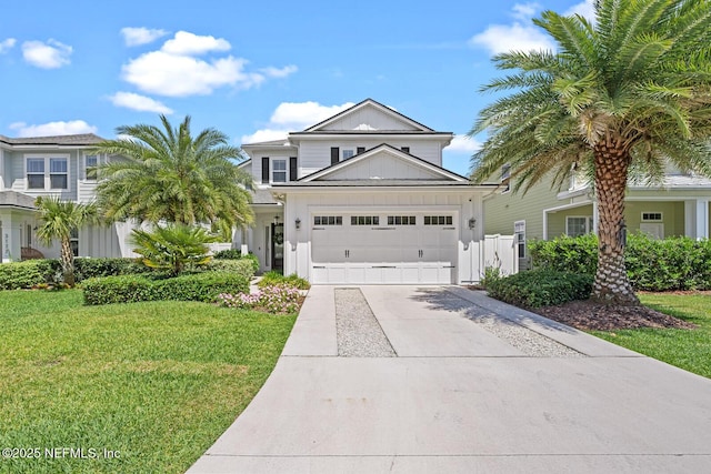 view of front facade featuring a front yard and a garage