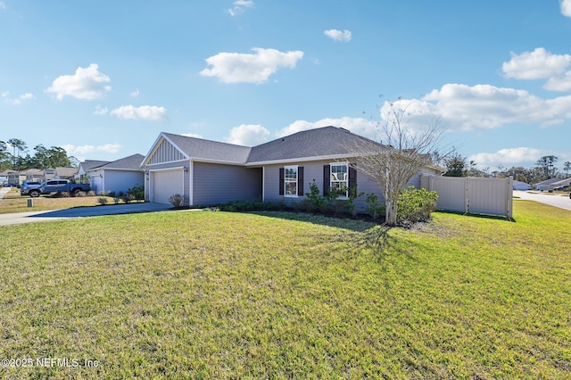 single story home featuring a garage and a front yard