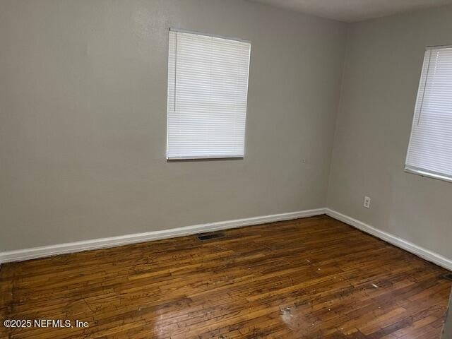 empty room featuring dark hardwood / wood-style floors