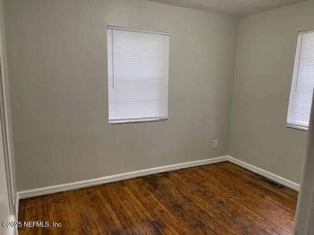 empty room featuring dark hardwood / wood-style floors