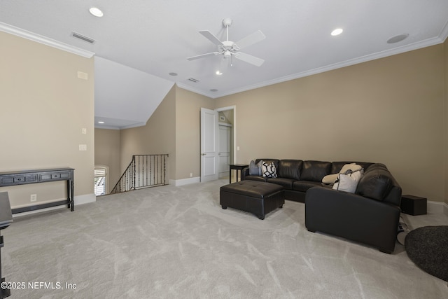 living room with crown molding, ceiling fan, and light carpet