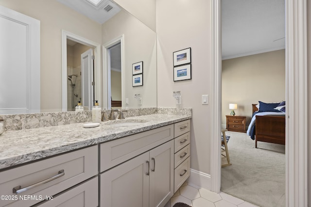 bathroom featuring tile patterned flooring, vanity, a shower, and ornamental molding