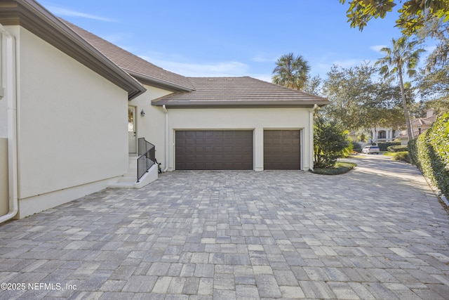 view of side of property featuring a garage