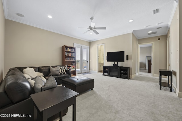 living room with ceiling fan, light colored carpet, crown molding, and french doors