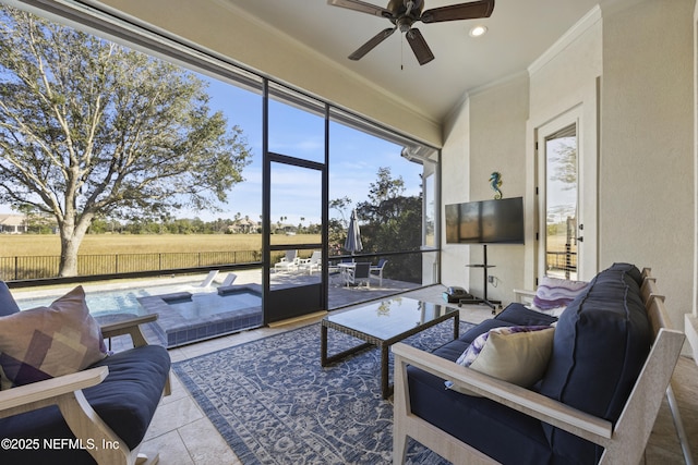 sunroom with ceiling fan