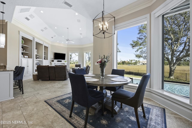 dining room with built in shelves, a wealth of natural light, crown molding, and ceiling fan with notable chandelier