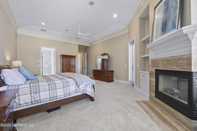 bedroom with connected bathroom, ceiling fan, crown molding, and light carpet