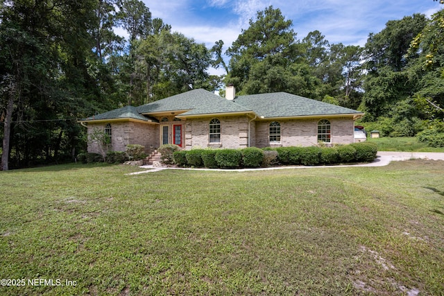 ranch-style home featuring a front yard