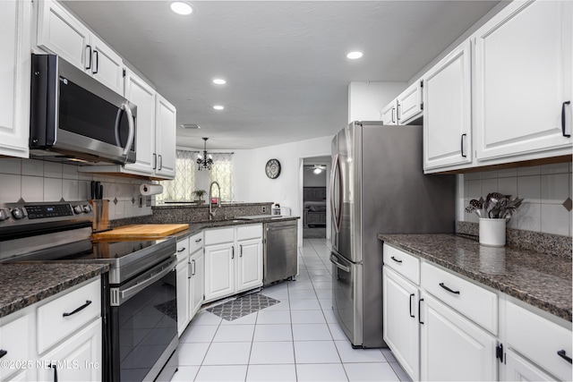 kitchen featuring white cabinetry, sink, and stainless steel appliances