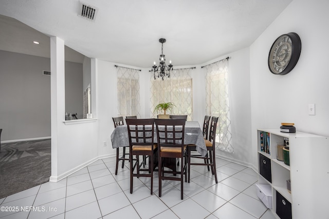 dining space featuring a chandelier