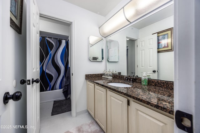 bathroom with tile patterned flooring, vanity, and shower / tub combo