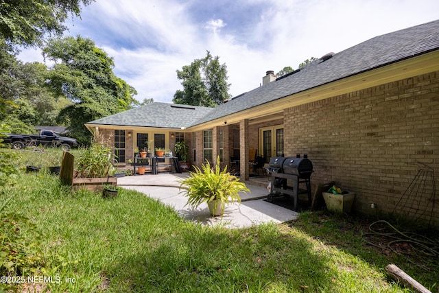 back of house with a patio area