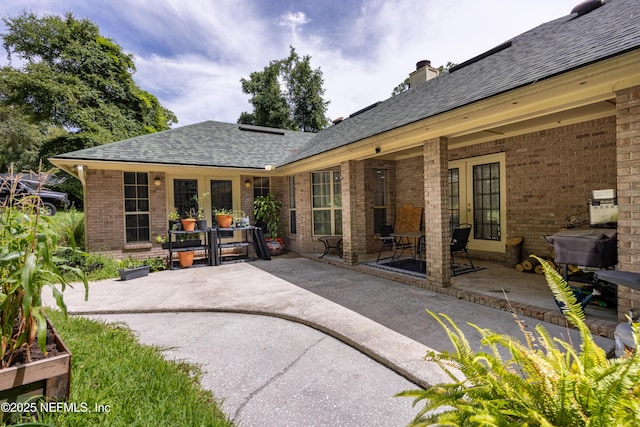 back of house with a patio