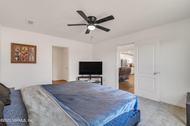 carpeted bedroom featuring ceiling fan