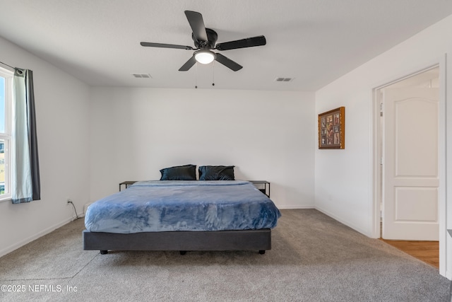 bedroom with light carpet and ceiling fan