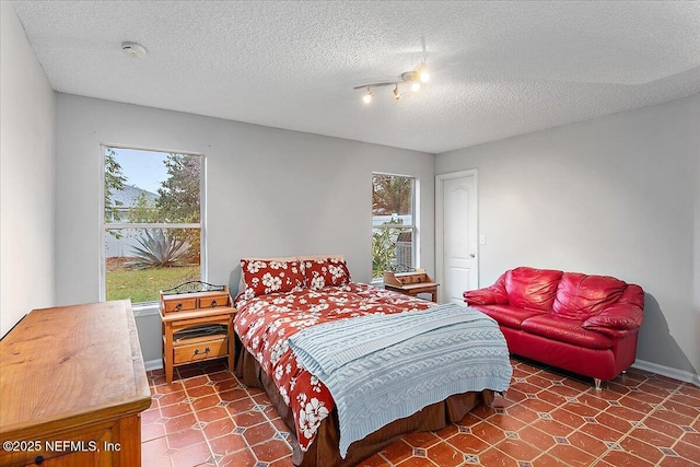 bedroom featuring a textured ceiling