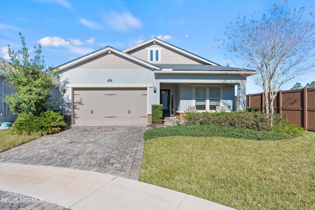 craftsman-style home with a front lawn and a garage