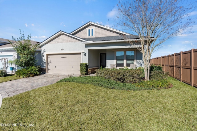 view of front facade with a garage and a front lawn