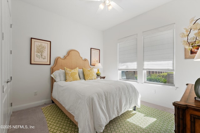 bedroom with ceiling fan and carpet flooring