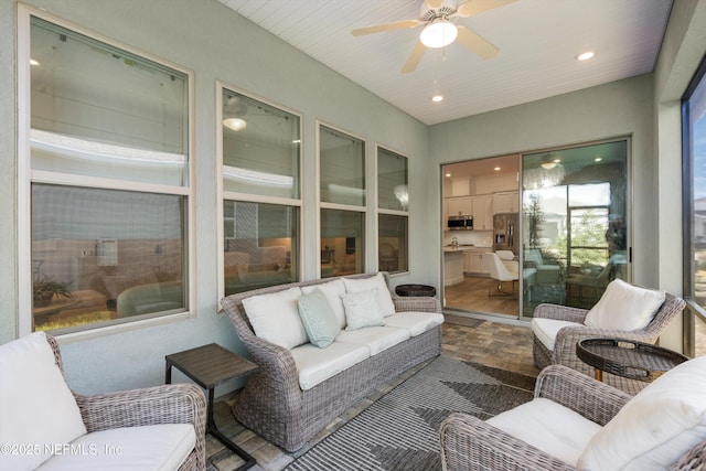 sunroom / solarium with ceiling fan