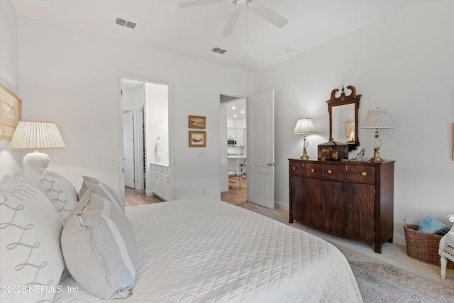 bedroom with ceiling fan and connected bathroom