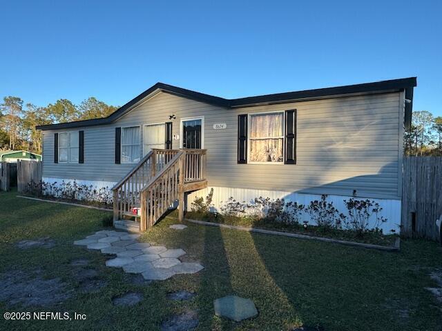 view of front of house with a front lawn