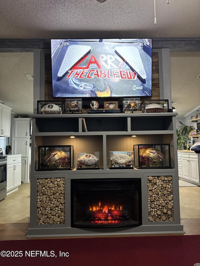 details with a fireplace, a textured ceiling, and stainless steel range